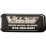Black on shiny silver rectangle Village Motor Sports domed label