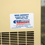 Weatherproof service label of red and blue print on white vinyl rectangle for Cool Solution Inc on air conditioner.
