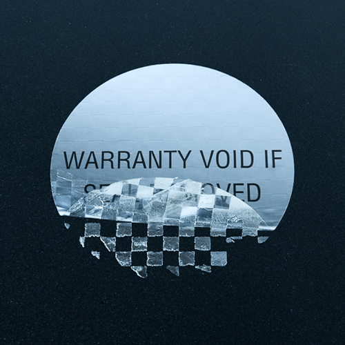 Circular silver warranty warning label with checkerboard residue pattern