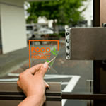 Orange and gree on clear square Food Recycling Project custom window decal on glass door
