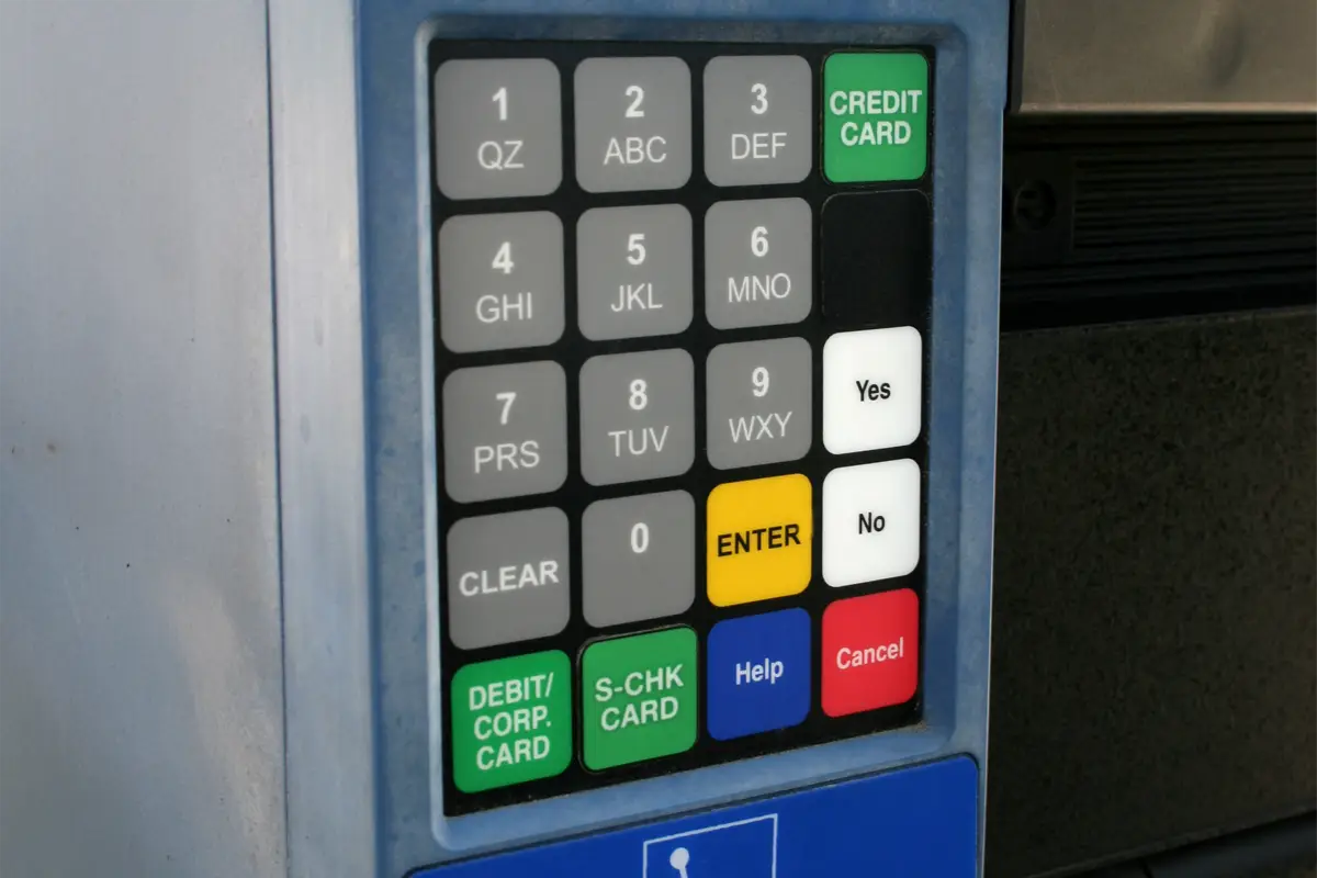 Graphic overlay with a keypad featuring numbered and colored functional buttons.