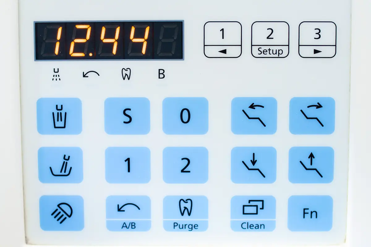Graphic overlay with a numeric keypad, function icons, and a digital display showing 12.44.