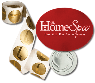 A partial uncoiled roll of circular foil labels