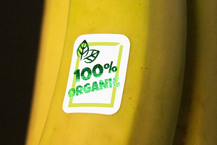Showcasing foil product labels on bananas, adding a unique touch to the fruit's packaging.