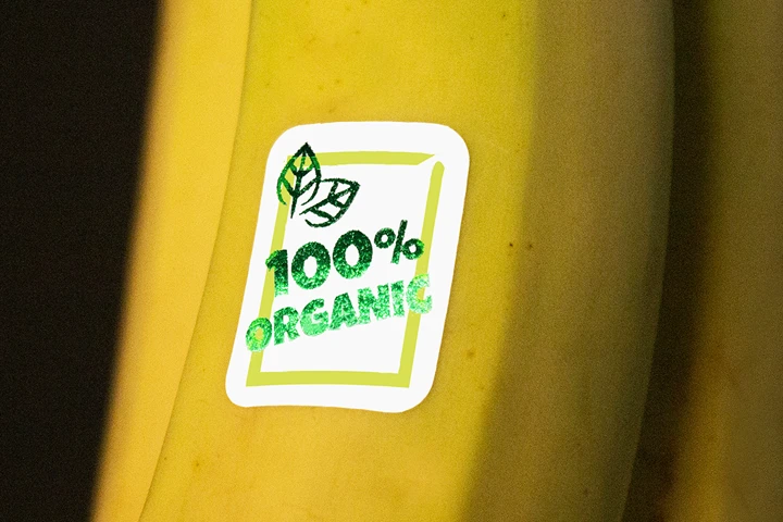 Showcasing foil product labels on bananas, adding a unique touch to the fruit's packaging.