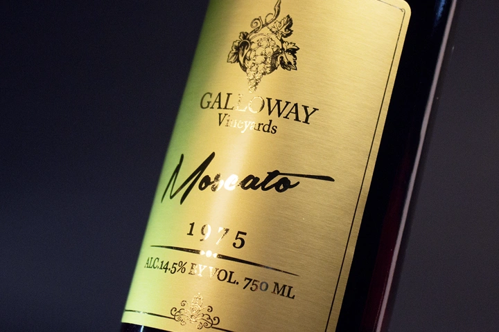 A wine label featuring captivating gold foil accents, adding a luxurious and opulent touch to the wine packaging.