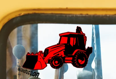 Self-Adhesive Equipment Labels Self-adhesive label featuring a red construction vehicle design on a glass surface.