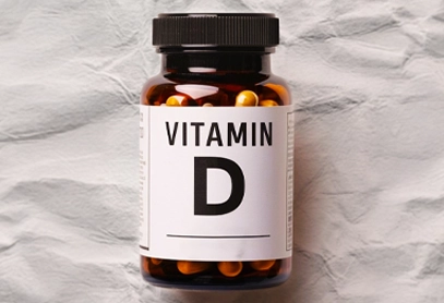 Vitamin D Bottle with Medication Label A brown bottle with a bold "Vitamin D" medication label.