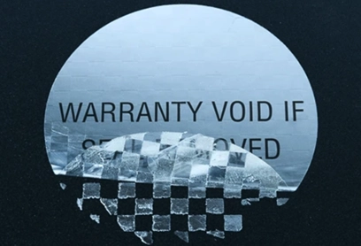 Tamper-Proof Labels with Checkered Security Polyester Tamper-proof checkered security polyester label with a "WARRANTY VOID IF REMOVED" message, showing a tamper-evident pattern when peeled.